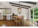 Cozy dining area featuring a round table, natural light, and views of the backyard at 687 Monticello Se Way, Marietta, GA 30067