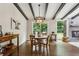 Open dining area with wood beams, a view of the backyard, and easy access to the kitchen at 687 Monticello Se Way, Marietta, GA 30067