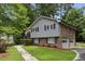Charming two-story home boasts brick accents, complemented by well-manicured lawn and a paved driveway at 687 Monticello Se Way, Marietta, GA 30067