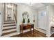 Welcoming foyer with hardwood floors, staircase, and a view of the front door at 687 Monticello Se Way, Marietta, GA 30067