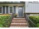 Charming front entrance with brick steps and wrought iron railing at 687 Monticello Se Way, Marietta, GA 30067