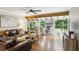 Bright and airy living room featuring hardwood floors, beamed ceilings and exposed brick fireplace at 687 Monticello Se Way, Marietta, GA 30067