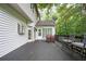 Spacious back deck with outdoor seating and a wooded backyard at 13789 Woolsey Rd, Hampton, GA 30228