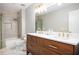 Bathroom with a double vanity and a shower/tub combo at 13789 Woolsey Rd, Hampton, GA 30228