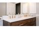 Modern bathroom featuring a stylish double vanity with gold hardware and fixtures at 13789 Woolsey Rd, Hampton, GA 30228