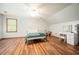 Bedroom with a bed, hard wood floors, a ceiling fan, and a vanity with mirror and matching stool at 13789 Woolsey Rd, Hampton, GA 30228