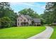 Elegant brick home with a large front yard and long drive at 13789 Woolsey Rd, Hampton, GA 30228