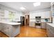 Open kitchen featuring stainless appliances, granite counters, tile backsplash, and plenty of cabinet space at 13789 Woolsey Rd, Hampton, GA 30228