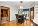 Eat-in kitchen with hardwood floors and views to other rooms through arched doorway at 13789 Woolsey Rd, Hampton, GA 30228