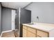 Finished basement kitchenette with a stainless steel refrigerator, sink, and light wood cabinets at 13789 Woolsey Rd, Hampton, GA 30228