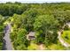 Aerial view of a home nestled among green trees, located close to the city at 2468 Fallview Ter, Atlanta, GA 30344