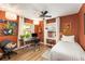 Inviting bedroom features warm colors, natural light, and a dedicated workspace at 2468 Fallview Ter, Atlanta, GA 30344