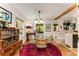 Bright dining room with hardwood floors, glass table, and natural light at 2468 Fallview Ter, Atlanta, GA 30344