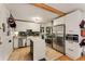Well-lit kitchen with white cabinets, marble island, and stainless steel appliances at 2468 Fallview Ter, Atlanta, GA 30344