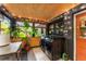 Bright laundry room with string lights, natural wood ceiling and black washer/dryer at 2468 Fallview Ter, Atlanta, GA 30344