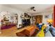 Bright living room boasts hardwood floors, ceiling fan, and an archway leading to a dining area at 2468 Fallview Ter, Atlanta, GA 30344