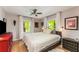 Comfortable main bedroom with hardwood floors and lots of natural light at 2468 Fallview Ter, Atlanta, GA 30344