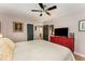 Spacious main bedroom with hardwood floors and a red accent dresser at 2468 Fallview Ter, Atlanta, GA 30344