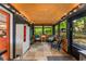 Bright sunroom with natural light, tile flooring, and an orange door at 2468 Fallview Ter, Atlanta, GA 30344