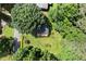 Aerial view of a home with large yard, lush landscaping, mature trees and a deck at 2600 Sandpiper Dr, Tucker, GA 30084