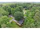 Aerial view of home with expansive backyard, wooded area and adjacent neighborhood at 2600 Sandpiper Dr, Tucker, GA 30084