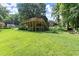Expansive backyard view featuring a raised deck, lush greenery and ample space for outdoor activities at 2600 Sandpiper Dr, Tucker, GA 30084