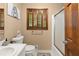 Cozy bathroom with a vanity, wood shutters, and a shower-tub combination at 2600 Sandpiper Dr, Tucker, GA 30084
