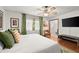 Comfortable bedroom showcasing hardwood floors and en-suite bathroom at 2600 Sandpiper Dr, Tucker, GA 30084