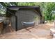 Expansive wooden deck with outdoor seating and a hammock, ideal for relaxation and enjoying the natural surroundings at 2600 Sandpiper Dr, Tucker, GA 30084