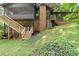 Home exterior displaying a screened-in porch, wooden deck, brick and siding, and stairs to the backyard at 2600 Sandpiper Dr, Tucker, GA 30084
