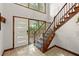 Foyer featuring light tile flooring and a view of the front door and staircase at 2600 Sandpiper Dr, Tucker, GA 30084