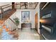 The foyer features a staircase and a view of the front door and the tiled floors at 2600 Sandpiper Dr, Tucker, GA 30084