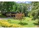 Beautiful home with lush greenery and a mature tree in the front yard at 2600 Sandpiper Dr, Tucker, GA 30084
