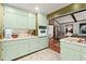 Charming kitchen with tiled floors and adjacent living space at 2600 Sandpiper Dr, Tucker, GA 30084