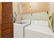 Functional laundry room with washer, dryer, and storage at 2600 Sandpiper Dr, Tucker, GA 30084