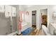 Bright bathroom featuring tub, glass enclosed shower, and modern fixtures at 58 Lilyfield Ln, Acworth, GA 30101