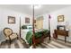 Charming bedroom featuring a four-poster bed, creating a cozy and inviting retreat at 58 Lilyfield Ln, Acworth, GA 30101