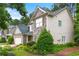 Charming two-story home featuring brick and stone accents, a well-manicured lawn, and a two-car garage at 58 Lilyfield Ln, Acworth, GA 30101