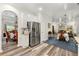 Bright kitchen featuring stainless steel appliances, hardwood floors, and views into a dining room at 58 Lilyfield Ln, Acworth, GA 30101