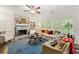 Comfortable living room with a stone fireplace and built-in shelving perfect for relaxing or entertaining at 58 Lilyfield Ln, Acworth, GA 30101