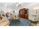 Cozy living room with beautiful cabinet and dining space, ideal for relaxation and entertaining at 58 Lilyfield Ln, Acworth, GA 30101