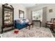Comfortable living room featuring a cozy blue sofa, stylish decor, and natural light at 58 Lilyfield Ln, Acworth, GA 30101
