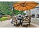 Inviting back deck with umbrella-covered outdoor seating, perfect for entertaining or relaxing outdoors at 245 Maple Shade Dr, Tyrone, GA 30290