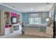 Bright bedroom with built-in shelving and window at 245 Maple Shade Dr, Tyrone, GA 30290