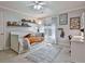 Bedroom with large windows, a ceiling fan and built-in shelving at 245 Maple Shade Dr, Tyrone, GA 30290