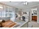 Bright bedroom featuring a built-in desk with carpet floors and ensuite bathroom at 245 Maple Shade Dr, Tyrone, GA 30290