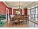 Formal dining room with hardwood floors, chandelier, and a large window at 245 Maple Shade Dr, Tyrone, GA 30290