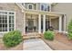 Inviting front porch with stone detail and seating, perfect for relaxing outdoors at 245 Maple Shade Dr, Tyrone, GA 30290