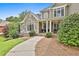 Charming home with stone accents and a walkway leading to the welcoming front porch at 245 Maple Shade Dr, Tyrone, GA 30290