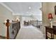 Hallway with carpeted floors and dark wood banister at 245 Maple Shade Dr, Tyrone, GA 30290